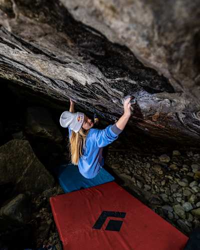 Shauna Coxsey powers through a challenging overhang during the Red Bull Bouldering Camp in Ticino, Switzerland, on November 24, 2025, showcasing world-class climbing passion.