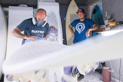 Keith Taboul and Levi Siver are seen working on a windsurfing powder board at Rishiri Island in Hokkaido, Japan on December 28, 2016