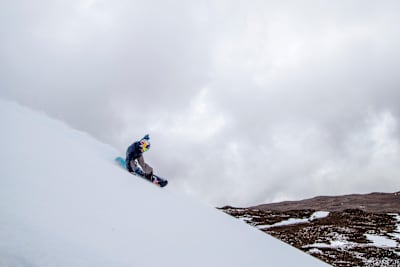 Snowboarder Lyon Farrell riding at Mauna Kea