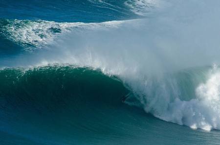 Surfer Fred David pulls into a barrel at big Nazare