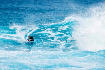 Caitlin Simmers surfing in Hawaii