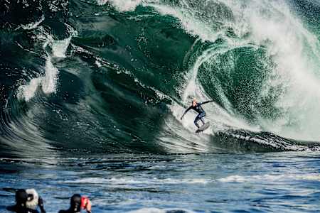 Surfer Mick Fanning rides a giant wave at Shipstern Bluff in Tasmania