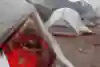 Sebastian Hofman sleeps next to a gas mask in tent next to volcano