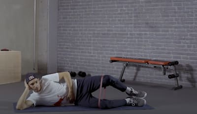 Superbike rider Toprak Razgatlioglu does Clam Shells during training.