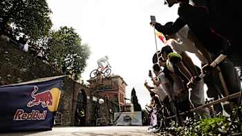 Sebastian Holguín performs a daring stunt at the Red Bull Genova Cerro Abajo 2024 in Genoa, Italy