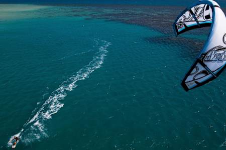 Brett Wright kite surfs off the coast of Eagle Island on the Great Barrier Reef, Australia.