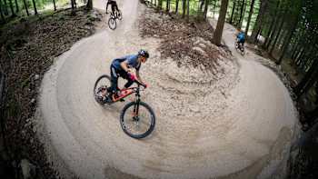 Riders find flow on a trail in Carinthia, Austria