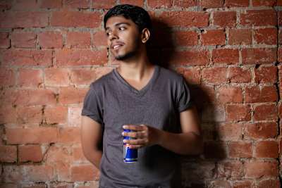 Esports player Arslan Ash poses with a can of Red Bull.