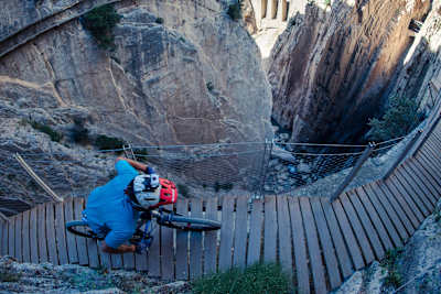 David Cachón rides his MTB on the perilous El Caminito del Rey walkway route near Malaga, Spain