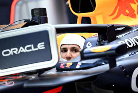 Isack Hadjar of France and Oracle Red Bull Racing prepares to drive in the garage during F1 Testing at Yas Marina Circuit on December 09, 2025 in Abu Dhabi,