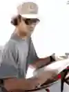 surfer waxing his surfboard