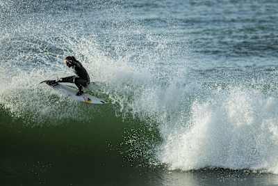 La surfer Justine Dupont sticks a turn on a wave at Seignosse