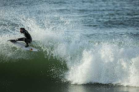 La surfer Justine Dupont sticks a turn on a wave at Seignosse
