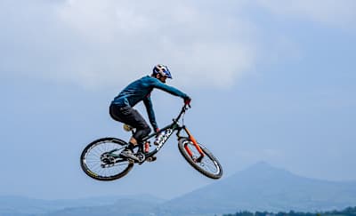 MTB Enduro athlete Greg Callaghan mid-air on his mountain bike during the shooting of his YouTube film 'Breaking the Cycle'.