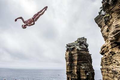 Gary Hunt of the UK dives from the 27 metre platform at Islet Franca do Campo during the third stop of the Red Bull Cliff Diving World Series, Sao Miguel, Azore