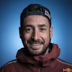 Greek paramotor pilot Dimitris Kolliakos poses for a studio headshot at the 2023 Red Bull Aerial Camp in Eloy, Arizona, United States.
