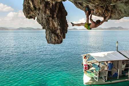 James Pearson Deep Water Soloing climbing on Sangat Island in the Philippines.