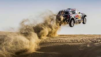 Nasser Al-Attiyah and Mathieu Baumel and the Qatar Rally Team in action