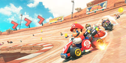 Screenshot aus Mario Kart World für Nintendo Switch 2 zeigt Mario und andere Charaktere beim Drift auf einer Wüstenstrecke.