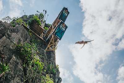 Molly diving from the platform in the Philippines