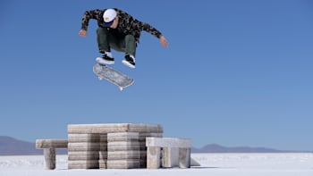Angelo Caro frontside kickflips high and clear over the salt configuration constructed for a one-off skate session in Bolivia