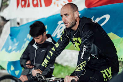 Eddie Masters warming up on bike listening to music.