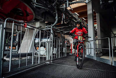 Amaury Pierron rides through a turnstile at the top of Val di Sole, Italy.