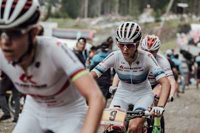 Women XCO racers take on a steep climb in Vallnord during the 2017 MTB World Cup.