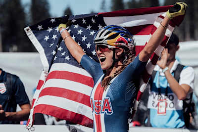 Kate Courtney celebrates victory at the 2018 UCI XCO World Championships in Lenzerheide, Switzerland on September 8, 2018.