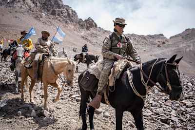 Mules carry people across the rough Andes terrain.