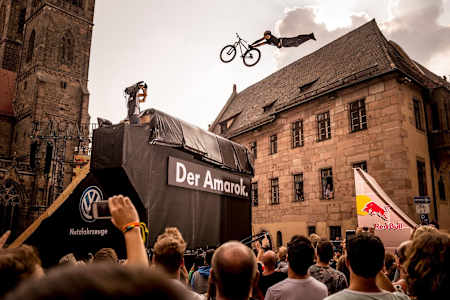Szymon Godziek pulls a Superman Seat Grab trick during District Ride.