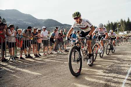 Nino Schurter leads a group of three during the XCC race at the UCI XCO World Cup at Lenzerheide, Switzerland, on August9, 2019.