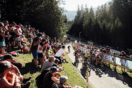 Rebecca Mcconnell leads a bunch of riders up climb during the XCC race at Rd 6 of the UCI MTB World Cup 2019 in Lenzerheide, Switzerland.