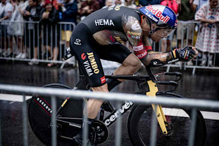 Wout van Aert speeding through the rain during the stage 1 time trial of the 109th Tour de France 2022 in Copenhagen, Denmark.