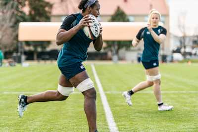 Players Alycia Washington and Kristine Sommer run hard at practice.