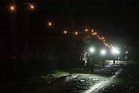 Competitors racing into the night in Notre Dame de la Gorge at UTMB 2017