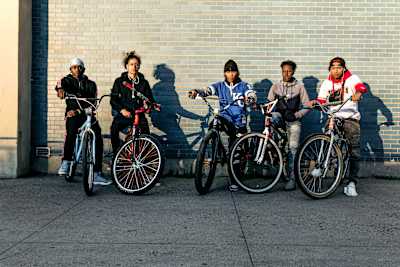 Five Bike Life riders pose for a photo.