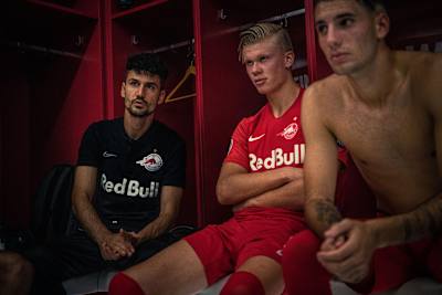 Erling Haaland listens in the dressing room with team-mates during Red Bull Salzburg's 6–2 victory against Genk in the Champions League group stages on September 17, 2019.