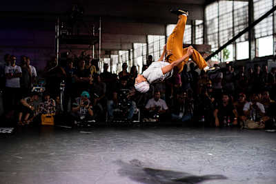 Logistix mid-air while doing a backflip.
