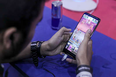 A gamer competes in Clash Royale during Red Bull M.E.O.