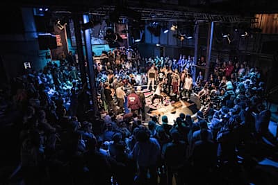 Two crews facing each other in a cypher.