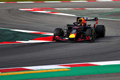 A photo of Red Bull Racing's F1 driver Pierre Gasly cornering during testing in Barcelona.