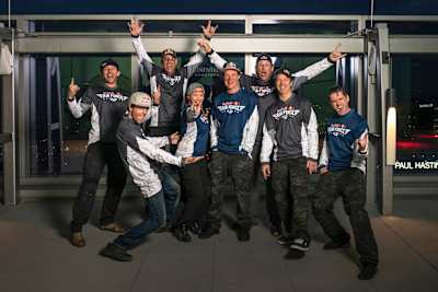 The Red Bull Air Force Team (L-R) Andy Farrington, Charles Brian, Miles Daisher, Amy Chmelecki, Mike Swanson, Luke Aikens, Jon DeVore and Sean MacCormac pose for a portrait on March 19, 2019.