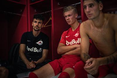 Erling Haaland listens in the dressing room with team-mates during Red Bull Salzburg's 6–2 victory against Genk in the Champions League group stages on September 17, 2019.