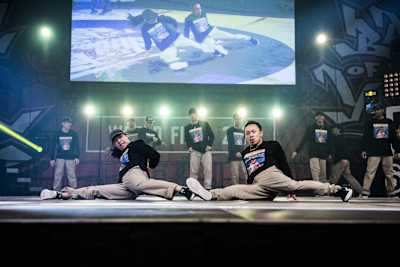 Breaking crew Flooriorz doing a synchronised routine at a Battle of the Year event.