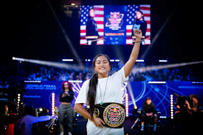 Logistx of the USA celebrates with her winners belts after the Red Bull BC One World Final at Ergo Arena in Gdansk, Poland on November 6, 2021.