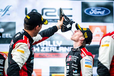 Kalle Rovanperä of team Toyota Gazoo Racing celebrates on the podium after winning their first FIA World Rally Championship title in Auckland, New Zealand.