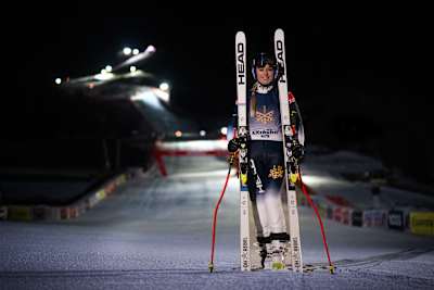 A portrait of skiier Lindsey Vonn having completed the Streif at night. 