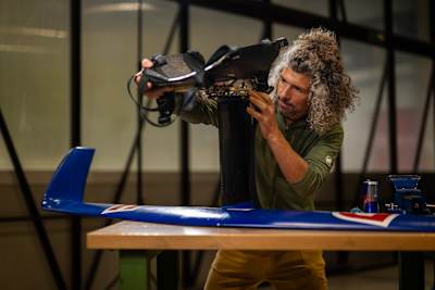 Andreas Podlipnik seen working on a prototype of the world's first wingsuit foil.