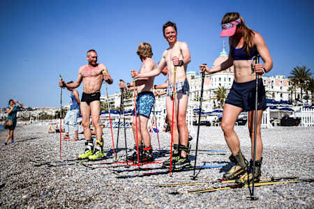 Athletes going into the sea with skis at Red Bull Der Lange Weg in Nice, France